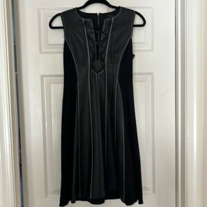 Fun and flirty BCBG MAXAZRIA faux leather and stretch fabric dress.